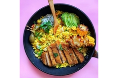 Image pan with fake meat, avocado, corn and cous cous.