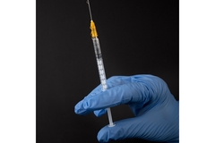 Image Hand in glove preparing injection for weight loss drug