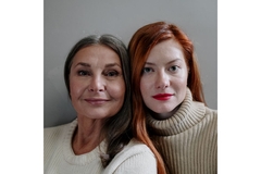 Image young and older women pose together looking ahead