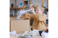 Image boy separating plastic for recycling