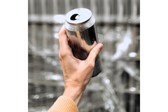 Image woman holding an aluminum can