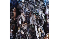 Image piles of clothes in a landfill