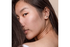 Image Asian woman looking back over her shoulder