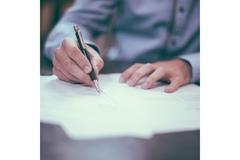Image man signing some papers