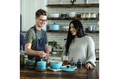 Image Young couple cooking with different ingredients