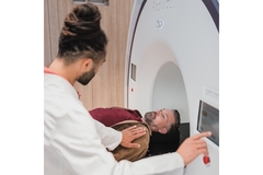 Man with diabetes getting an MRI scan by a male doctor