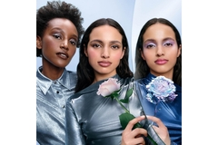 Image Three female models model with makeup.