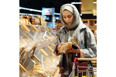 Image woman shopping bread at a supermarket