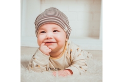 Laughing baby on a carpet.