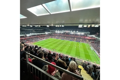 Fans at a full football stadium.