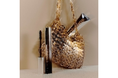 Image Metal pouch containing Rabanne mascara and foundation