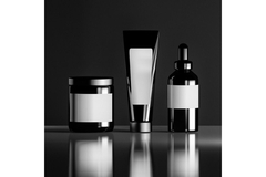 Three unbranded skin care bottles.