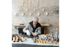 Image Perfumer matching essential oils to develop fragrances