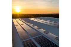 Image Solar panels on the roof of a building.