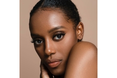 Woman face with clean and clear skin poses for camera.