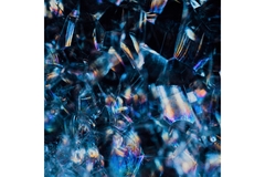 Image A closeup shot of the shimmering surface of a crystal.