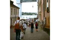 Man carrying a plastic bag in Sweden's shopping street