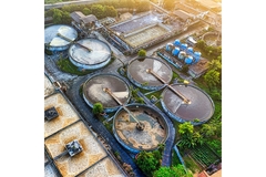 Image Aerial view of waste water treatment plants surrounded by green trees