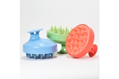 Image Three scalp brushes for shower use.