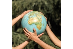two arms carrying the globe in the air
