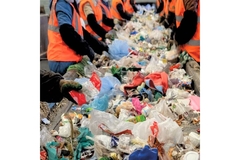 Image Workers sorting plastic waste.