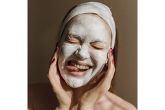 A woman wearing a leave-on face mask.