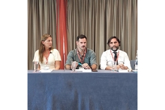 Image Three people at a panel.