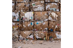 Squares of compacted paper to be recycled.