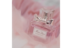 A Miss Dior perfume in pink fluffy material.