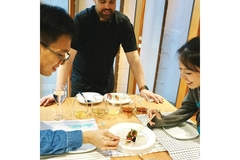 Image Two people trying innovative food.
