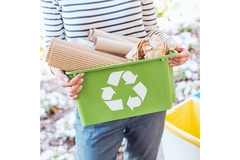 Activist recycling packaging waste.