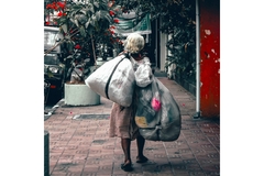Image Indonesian Woman Carrying Heavy Plastic Bags