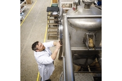 testing halls at lund university, researcher inspects a machine