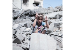 Image Palestinian girl in Gaza wreckage.