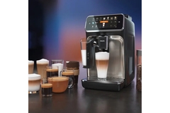 Image A coffee machine from Phillips surrounded by cups of coffee.