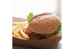Image Burger and fries in compostable food packaging.