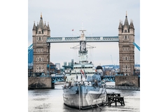 Image A boat in front of the London bridge.