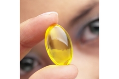 Image Holding up supplement pill.