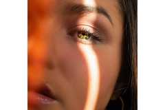 Image A sun strip across someone face and eye.