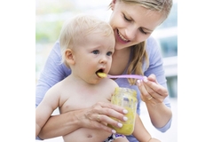 Image Mother feeding a baby.