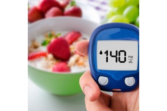Image Diabetes doing glucose level test fruits in background.