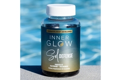 Image Bottle of edible spf near pool.