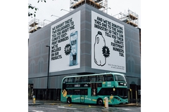Image Oatly posters on house facades in the UK.