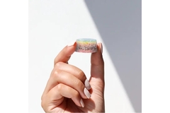 Image Hand holding a seven-layer gummy from Nourished.