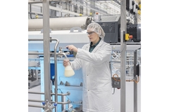 Image A person is developing for the production of plant-based food, including meat substitutes, plant-based drinks and ingredients.