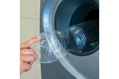 Returning emty plastic beverage bottle.