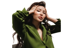 Image A woman with smooth skin poses.
