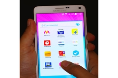 Image Person tapping apps on smartphone.