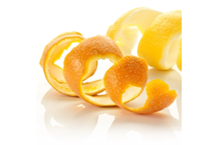 Image Two pieces of orange skins are placed on a white table.