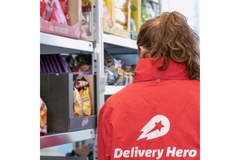 Image A person is selecting items for delivery.